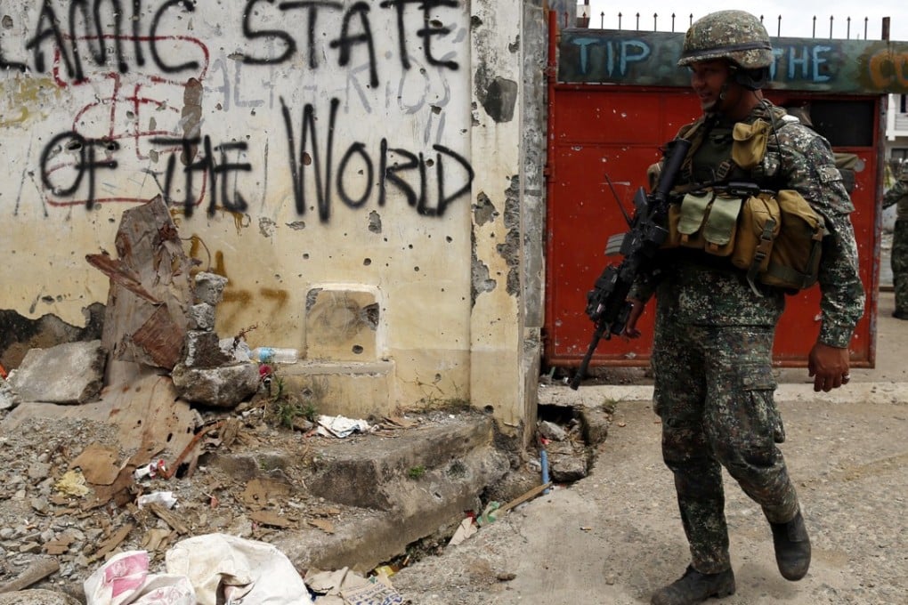 The Philippine army is trying to confirm whether a Malaysian militant leader survived the defeat of an Islamic State-linked siege in Marawi city. Photo: EPA