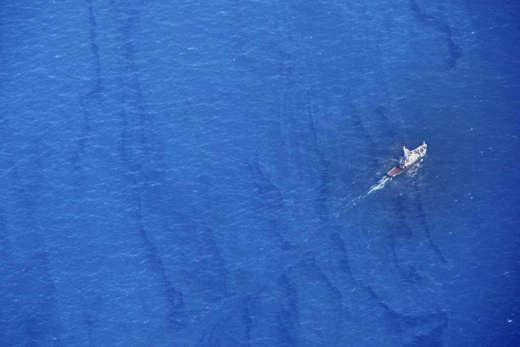 The oil spill is seen on the water’s surface on Monday, near where the Sanchi sank in the East China Sea. Photo: Xinhua