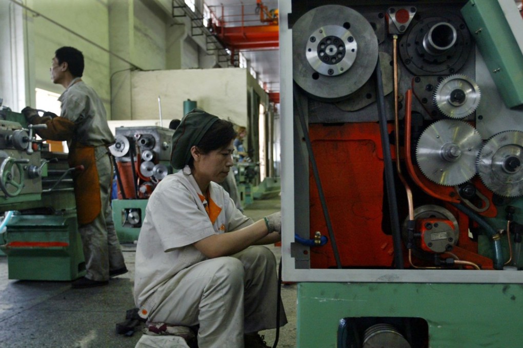 Chinese workers are seen on the production line of Shenyang No 1 Machine Tool Works in Liaoning province in this file photo from 2004. Once the crown jewel of China’s centrally planned economy, today the northeast is the country’s rust belt, but e-commerce giant JD.com wants to help revitalise the area. Photo: Reuters