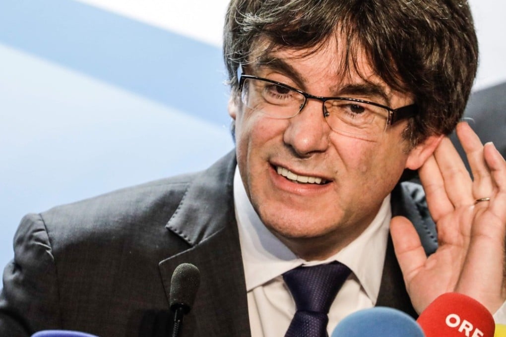 Ousted Catalan president Carles Puigdemont is under fire for sharing a video that combined second world war footage of Hitler and Franco with images of Spanish Prime Minister Mariano Rajoy. Photo: Agence France-Presse