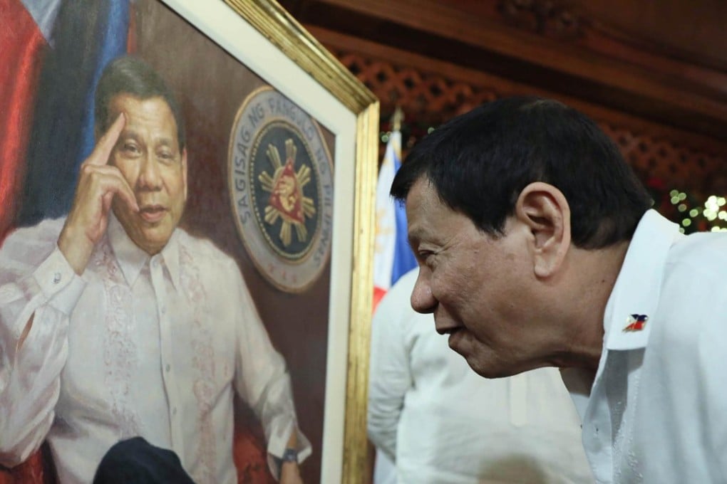 President Rodrigo Duterte admires a portrait of himself at the presidential palace in Manila. Photo: EPA-EFE