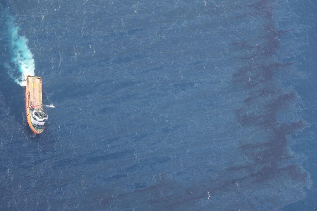 A Chinese supply ship helps out in a clean-up operation in the East China Sea. Photo: AFP