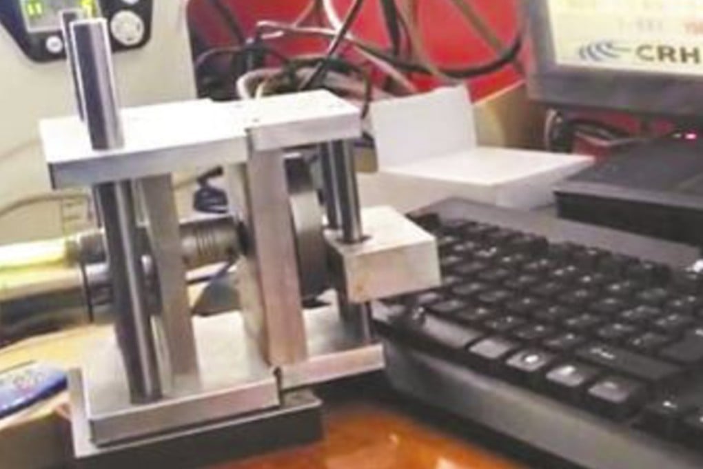 The robot arm refreshed the train booking website every second to increase the man’s chances of getting in-demand tickets. Photo: Xinhua