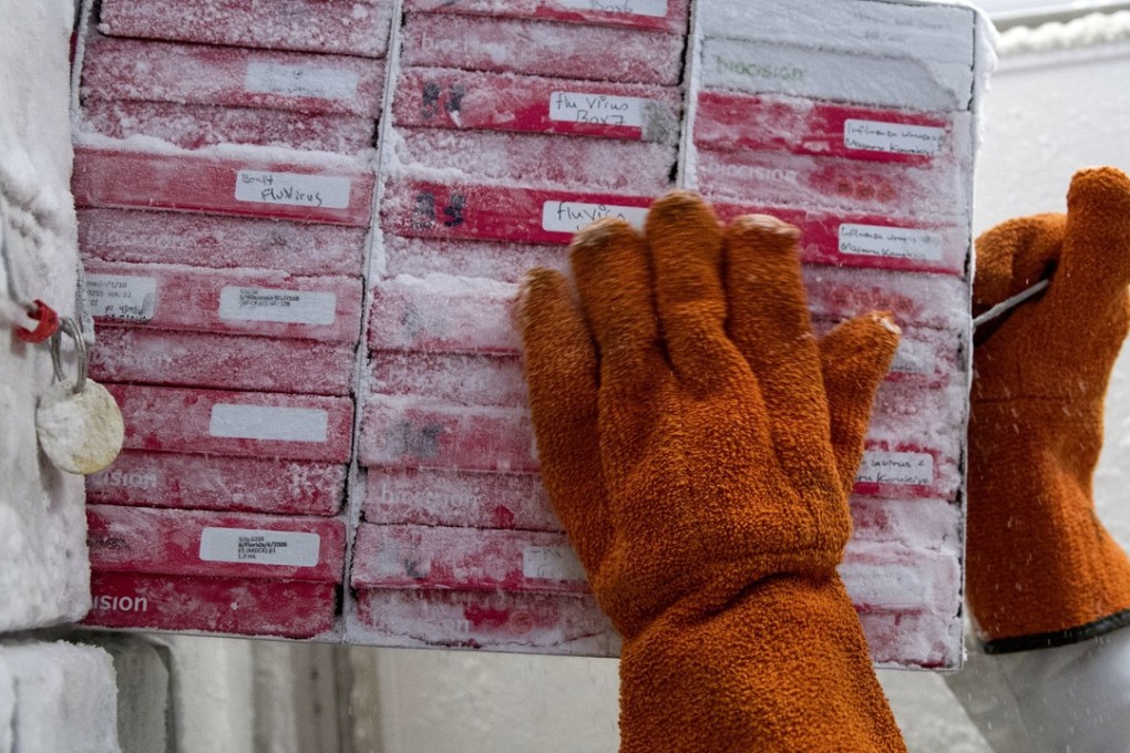 Biologist Rebecca Gillespie pulls boxes of flu virus strains from a freezer at the Vaccine Research Centre at the US National Institutes of Health, last month in Bethesda, Maryland. Photo: AP