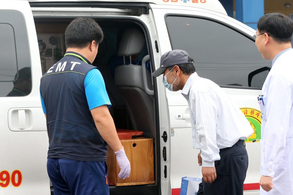 A man gets into an ambulance at a hospital in the southeastern city of Daegu, South Korea. Photo: EPA/YONHAP