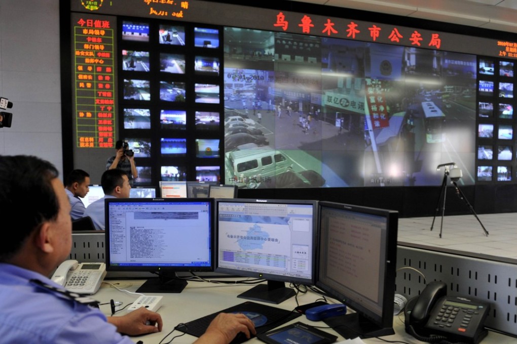Police officers watch screens showing areas monitored by security cameras in Urumqi, capital of northwestern China's Xinjiang. The latest methods of surveillance in the restive region are based on facial recognition, a source said. Photo: AFP