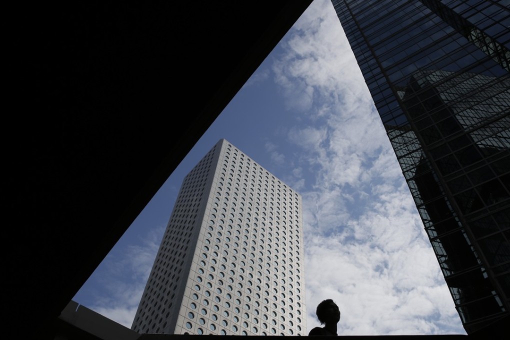A man walks down the stairs in the Central, a business district of Hong Kong, Thursday, Nov. 9, 2017. (AP Photo/Kin Cheung)
