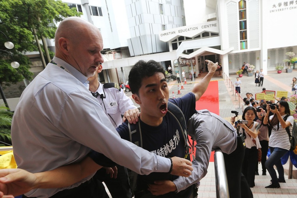 A member of a student concern group protests on the campus of Hong Kong Baptist University’s Ho Sin Hang Campus. Photo: Sam Tsang