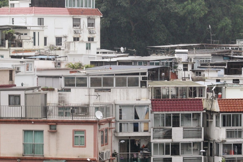 The government faces so many obstacles in its efforts to get rid of illegal structures which can pose a risk to pedestrians. Photo: Edward Wong