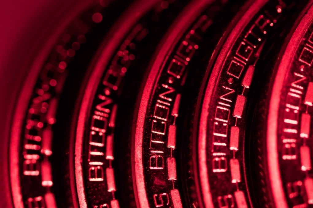 A collection of bitcoin tokens sit in this arranged photograph in London, UK, on Tuesday, January 9, 2018. On Wednesday, billionaire Warren Buffett said on CNBC that most digital coins won't hold their value. Photo: Bloomberg