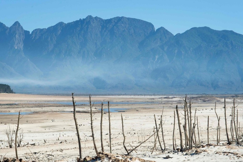 File photo from May 10, 2017 shows bare sand and dried tree trunks standing out at Theewaterskloof Dam, which has less than 20 per cent of its water capacity, near Villiersdorp, about 108km from Cape Town, which suffered its worst drought in a century. The year 2017 is one of the three hottest years on record, scientists said. Photo: AFP