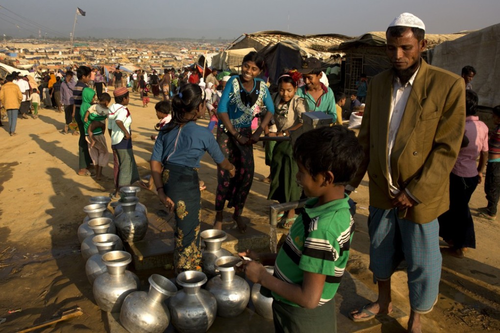 Rohingya refugees fetch drinking water from a hand pump at Balukhali refugee camp, 50km from, Cox’s Bazar, Bangladesh. Photo: AP