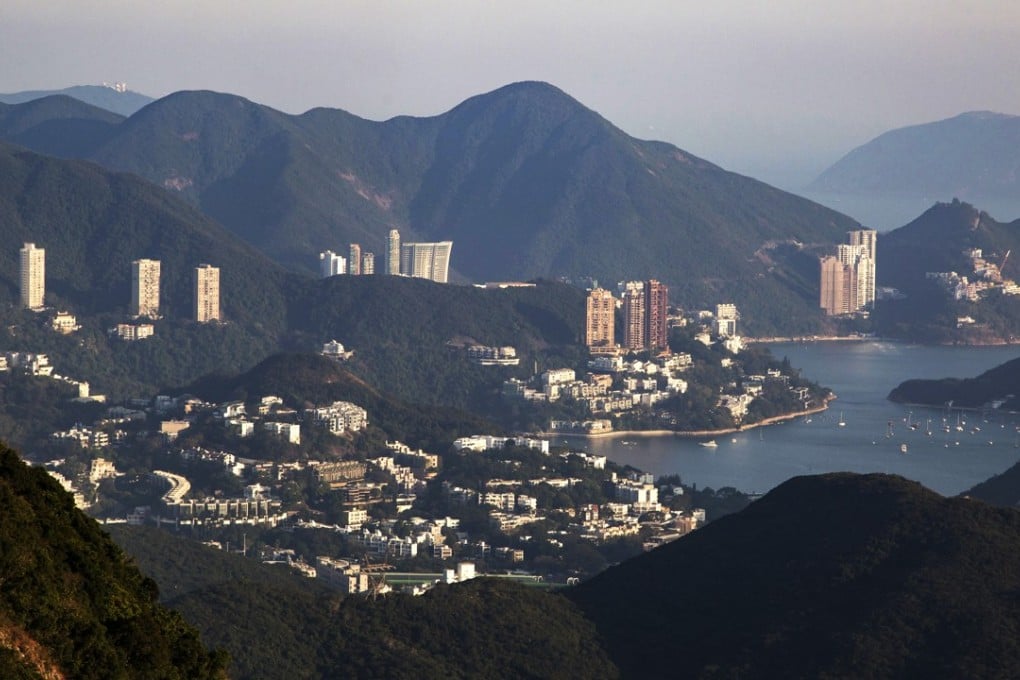 Residential buildings stand in the Deep Water Bay and Repulse Bay areas. Cheap money is the single most important cause of the asset bubbles affecting real estate in many cities, and stock prices globally. Photo: Bloomberg