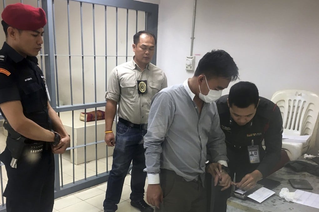 Police process suspected wildlife trafficker Boonchai Bach. Photo: AP
