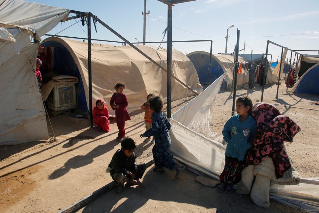 Displaced Iraqi children seen at the Amriyat al Fallujah camp in Anbar Province, Iraq on January 3, 2018. Photo: Reuters