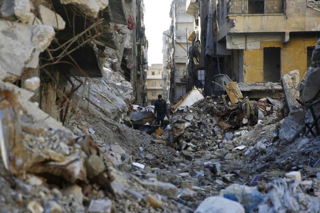 A Syrian walks through the destruction of the Salaheddine neighbourhood in the eastern Aleppo, Syria. Photo: AP