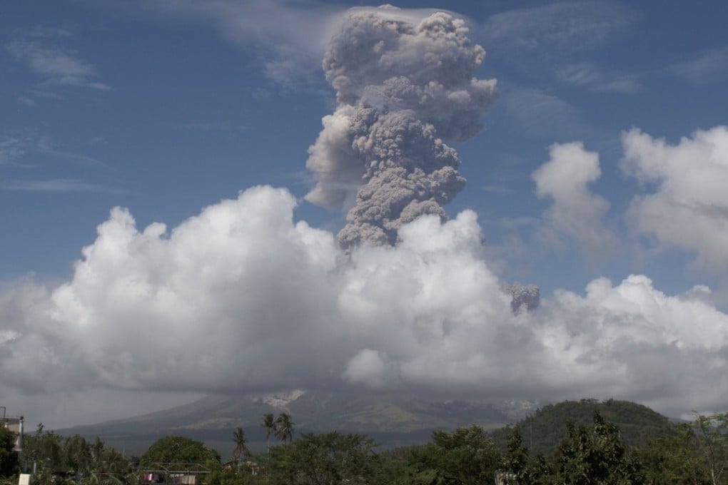 A huge column of ash shoots up to the sky during the eruption of Mayon volcano Monday. Photo: AP