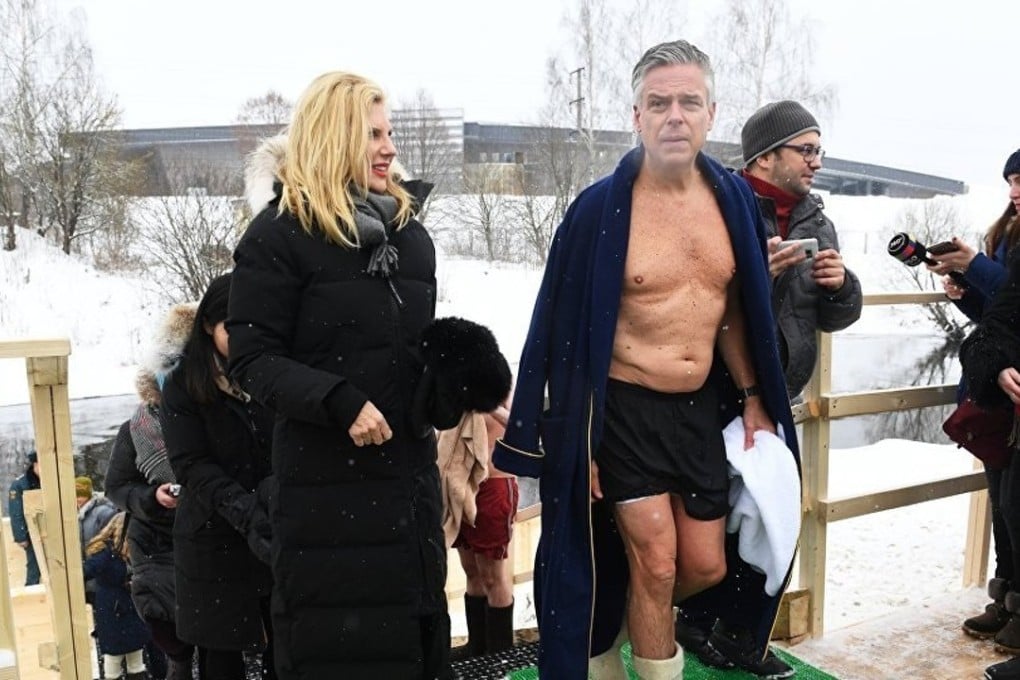 US Ambassador to Russia Jon Huntsman emerges from the icy Istra River outside Moscow on Sunday. Photo: Sputnik