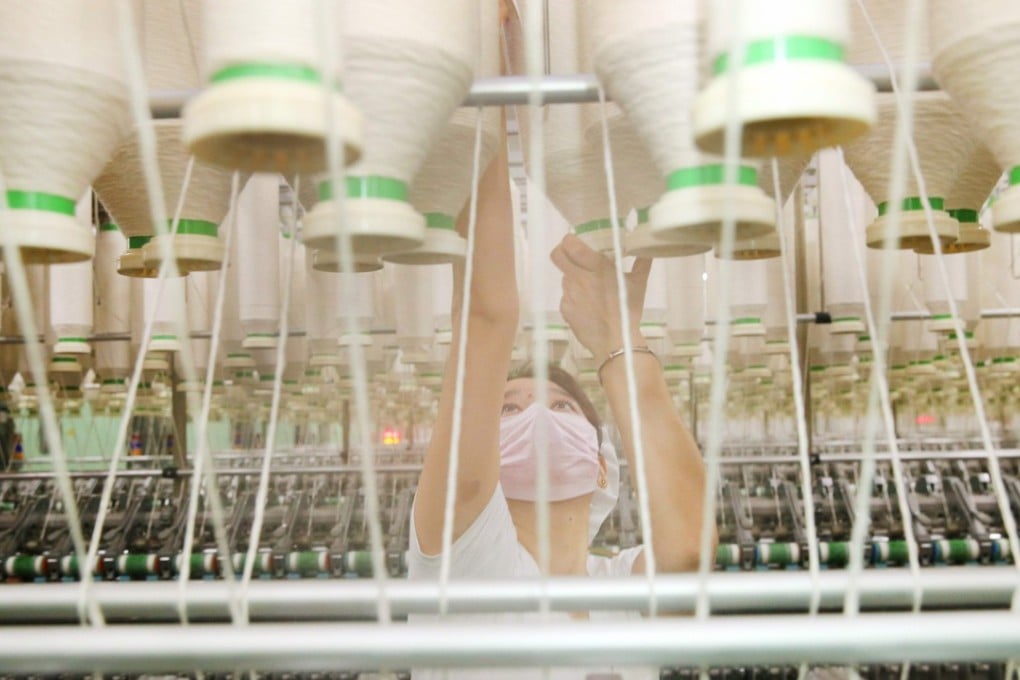 A textile factory in China's eastern Jiangsu province. More and more entrepreneurs on the mainland are ready to give up majority ownership and control of their companies. Photo: AFP