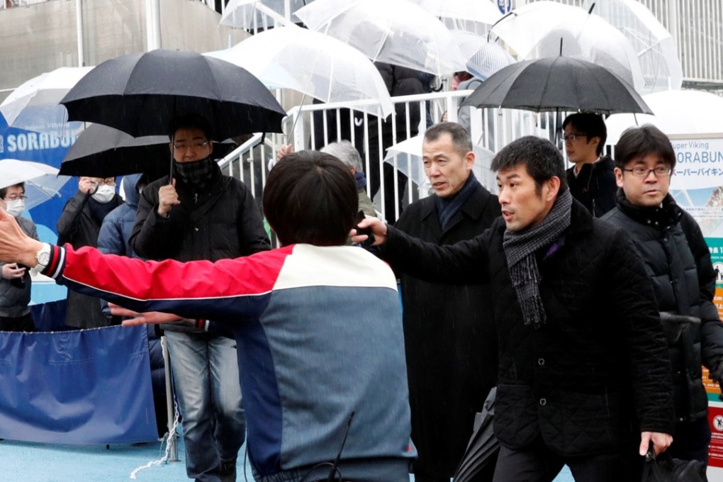 Staff direct participants during the anti-missile evacuation drill at the Tokyo Dome City amusement park in Tokyo. Photo: Reuters
