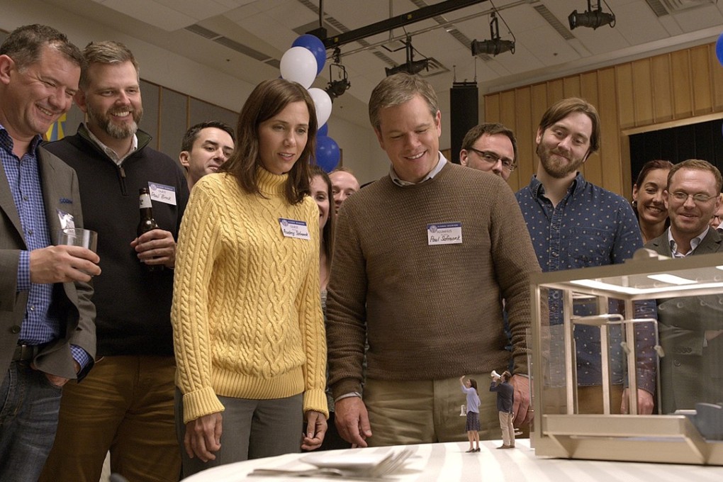 Kristen Wiig and Matt Damon (centre) consider a smaller life in the film Downsizing.
