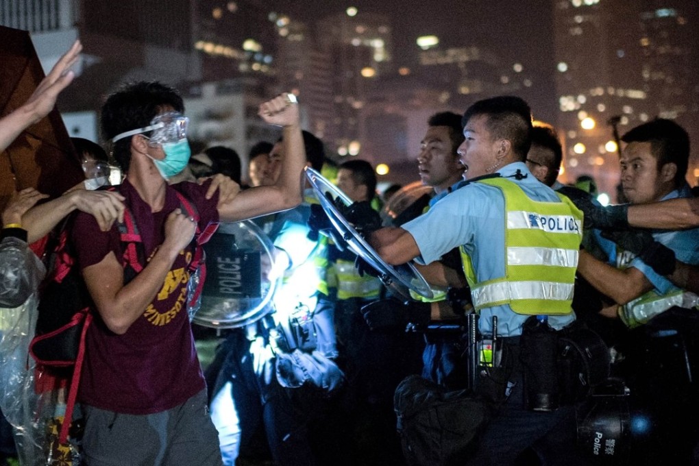 Protesters and police clash during the 2014 Occupy movement, the consequences of which are still reverberating today in court cases that have sparked controversy. Photo: AFP/ Alex Ogle