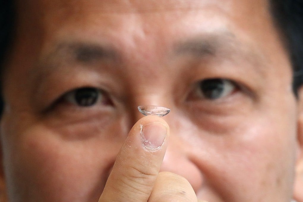 Vision Science founder Jackson Leung showing a contact lens that can reduce myopia in children. Photo: K.Y. Cheng