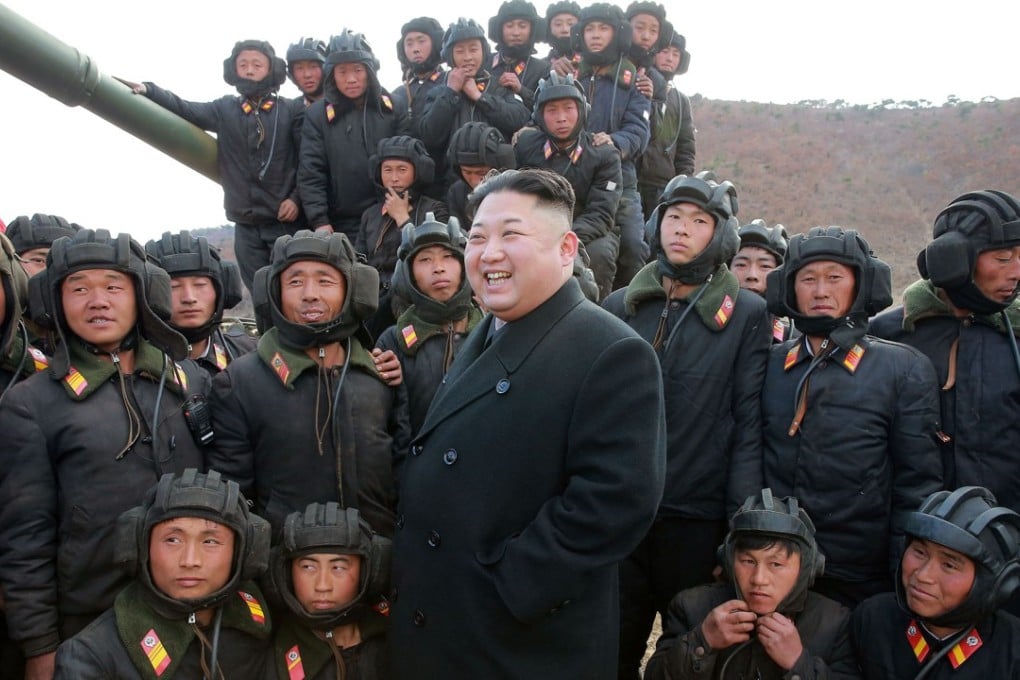 Kim Jong-un with tank crews. Photo: TNS