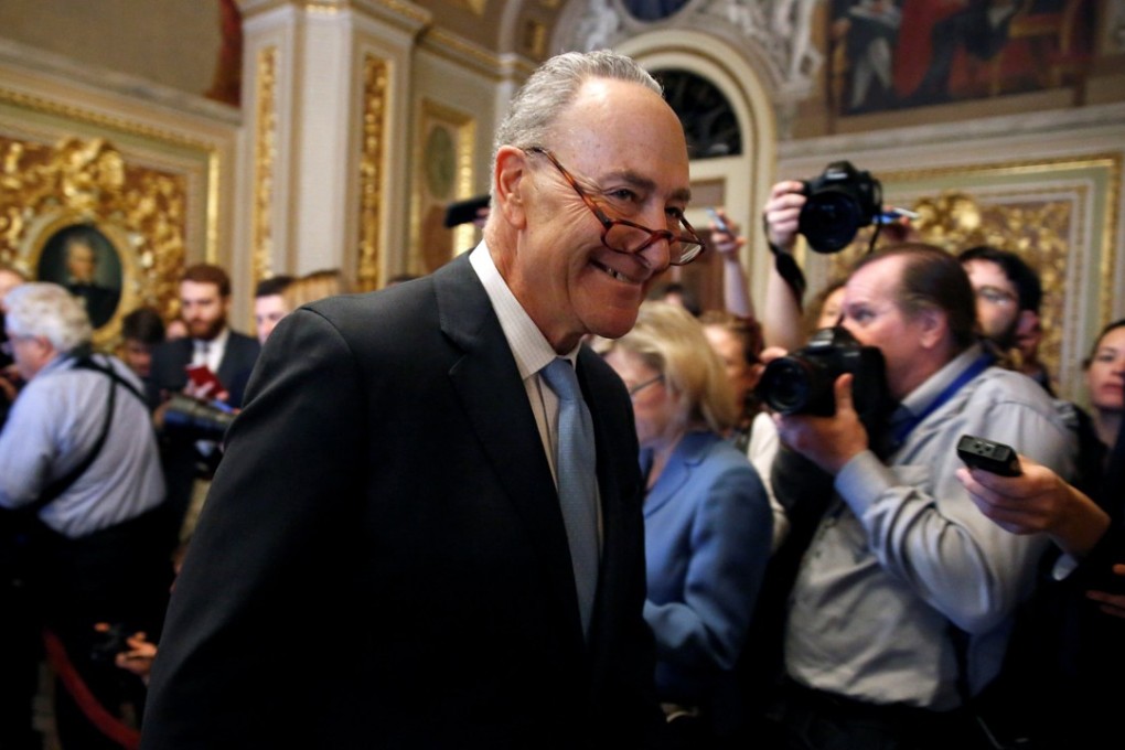 Senate Minority Leader Chuck Schumer is seen walking from a meeting on Monday. Schumer confirmed on Monday that Democrats would vote in favour of a bill to reopen government temporarily. The funding is expected to last until February 8. Photo: Reuters