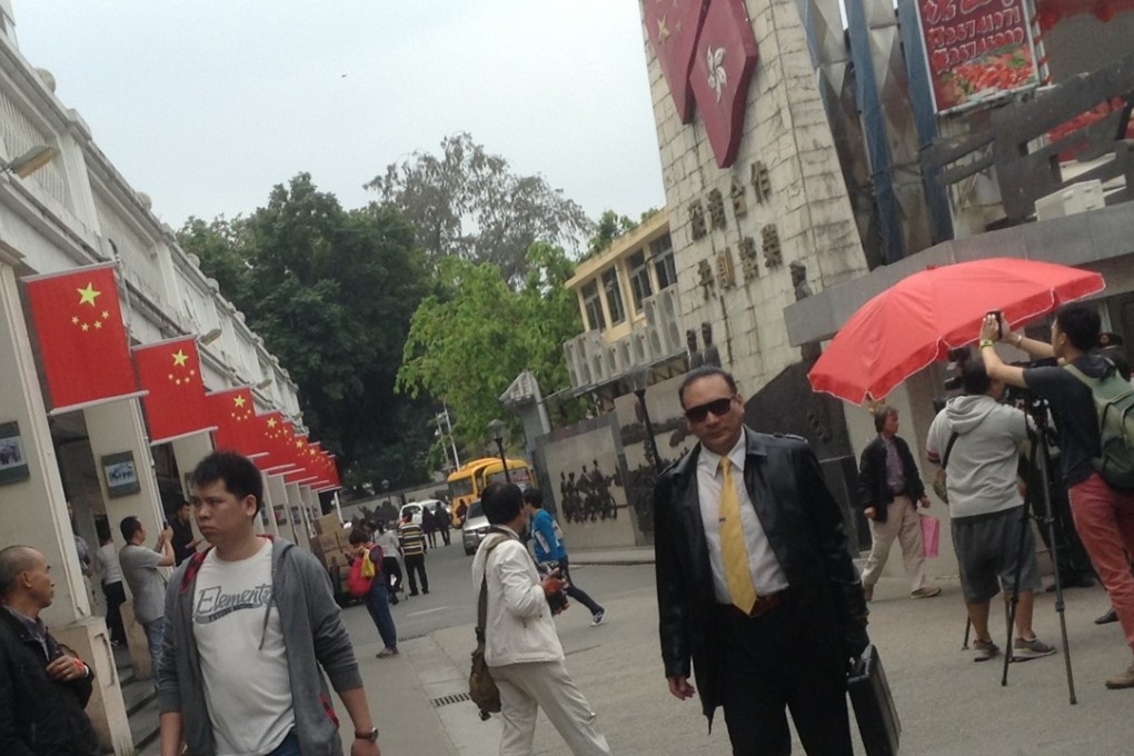 Chung Ying Street, the porous border between Sha Tau Kok in Hong Kong and Shenzhen. The street separates the mainland (left) from Hong Kong (right). Photo: Ernest Kao
