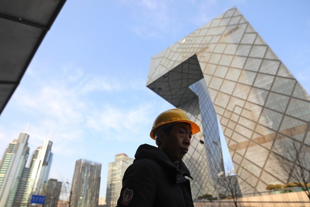 Beijing is a lynchpin in the national economy, but has been trying to limit growth of its population. Photo: EPA