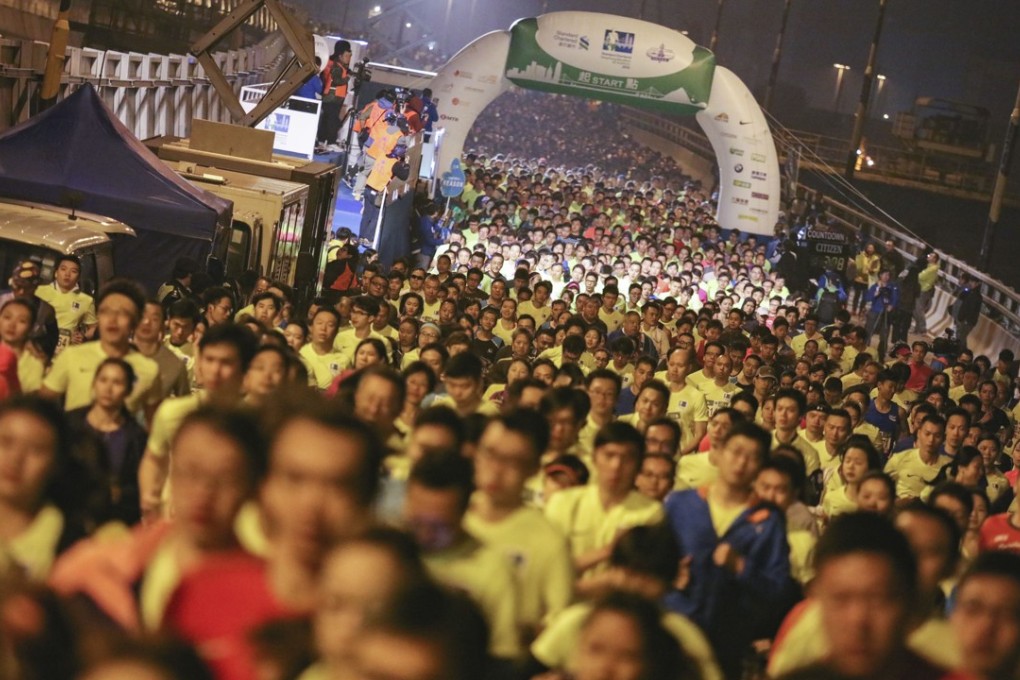 Competitors run along the Island Eastern Corridor during the 10km Standard Chartered Hong Kong Marathon. Photo: Felix Wong