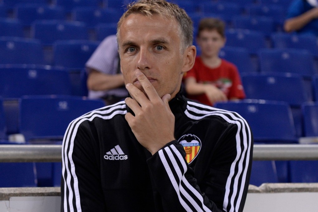Phil Neville was a coach at Valencia when his brother Gary Neville was in charge. Photo: AFP