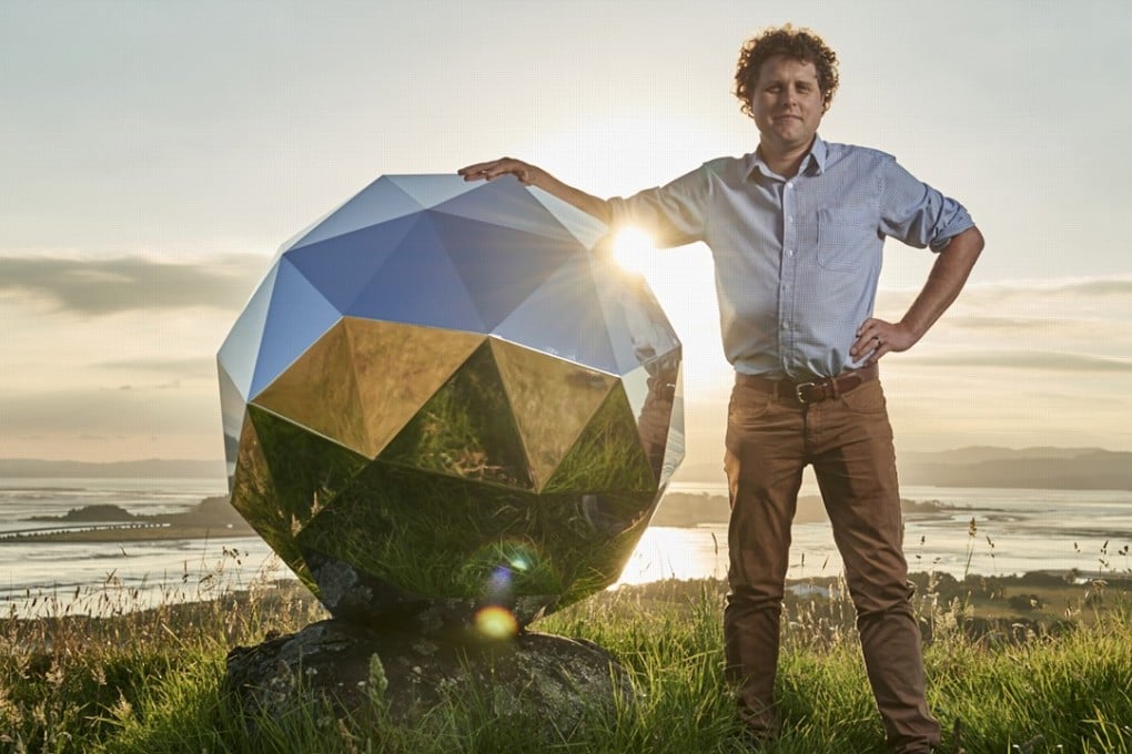 Rocket Lab founder and CEO Peter Beck is pictured with his Humanity Star satellite in Auckland, New Zealand. The satellite ins now in orbit. Photo: Rocket Lab via AP