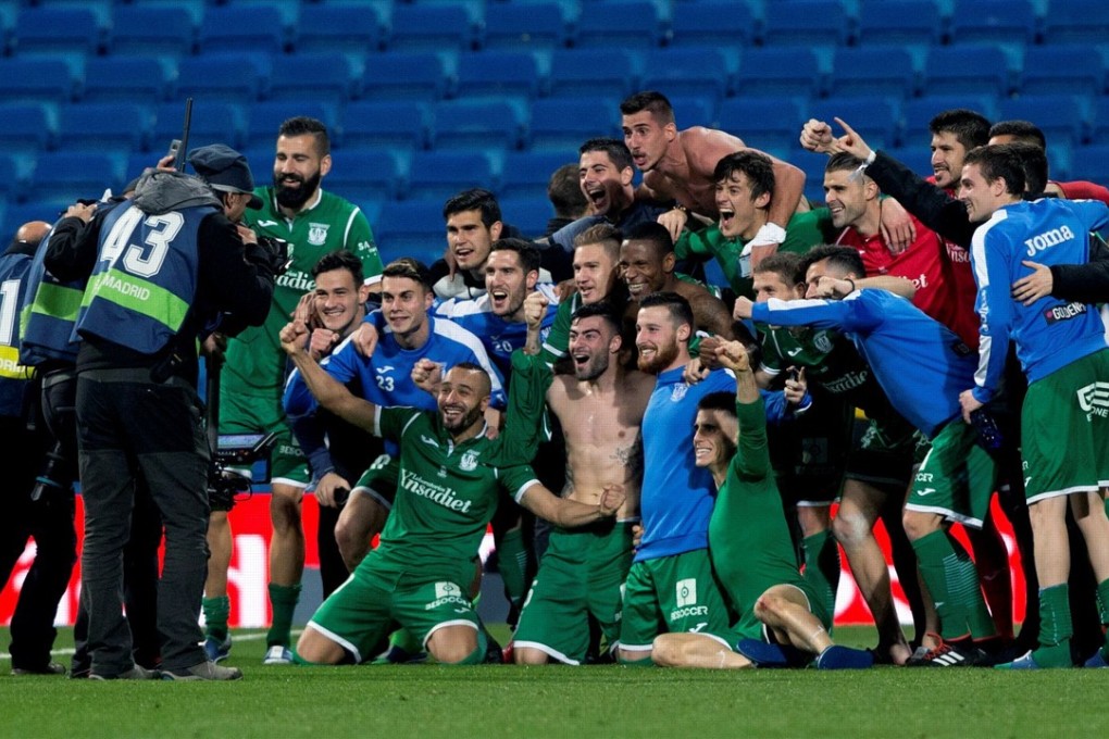 Leganes’ players celebrate a famous victory over Real Madrid during the King’s Cup quarter-final second leg. Photo: EPA