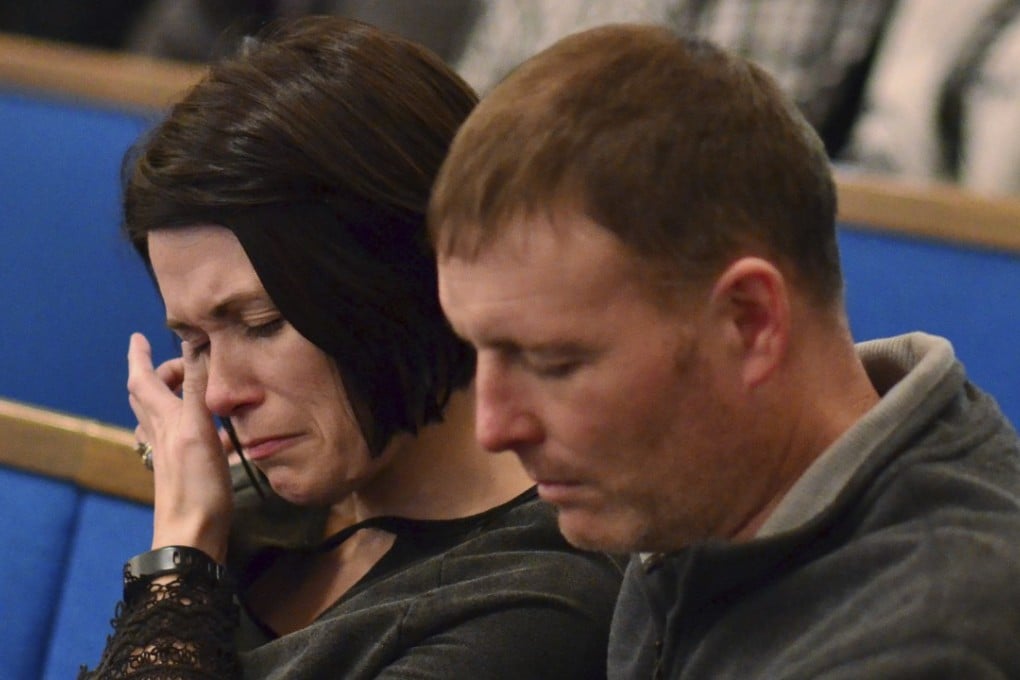 A woman wipes tears from her eye during a prayer vigil at Briensburg Baptist Church near Benton, Kentucky., on January 23, 2018. Bailey Nicole Holt and Preston Ryan Cope, both 15, were killed and another 17 people injured when a classmate opened fire on Tuesday as investigators looked for a motive behind the shooting. Photo: AP