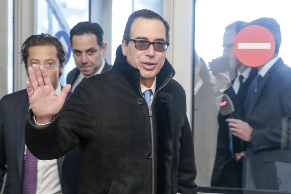 US Treasury Secretary Steven Mnuchin (center) arrives for a press briefing on day two of the World Economic Forum (WEF) in Davos, Switzerland, on Wednesday. Mnuchin has ordered sanctions on Chinese and North Korean businesses in China and Russia, saying they are aiding the rogue state. Photo: Bloomberg/Jason Alden.