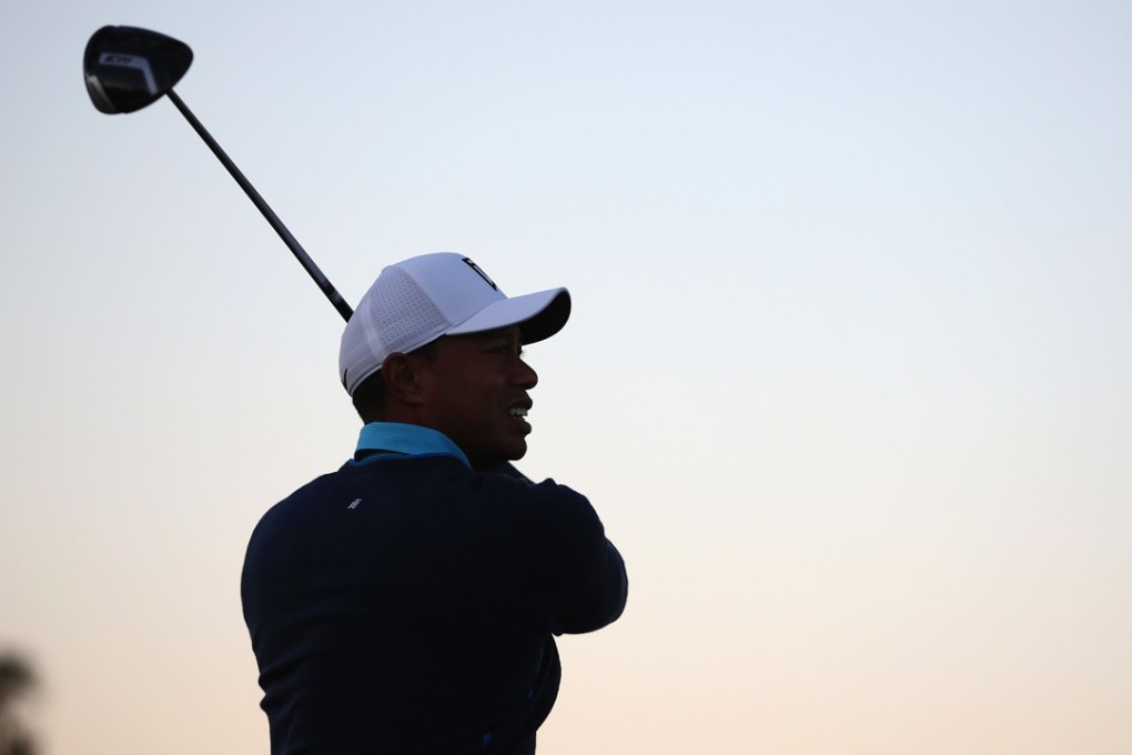 Tiger Woods hits a shot on the second hole during the pro-am round of the Farmers Insurance Open at Torrey Pines Golf Course. Photo: AFP