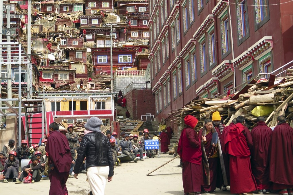Eight months of demolition and expulsion has reduced the size of Larung Gar, a sprawling Buddhist centre of learning and prayer in the mountains of Sichuan. Photo: AP