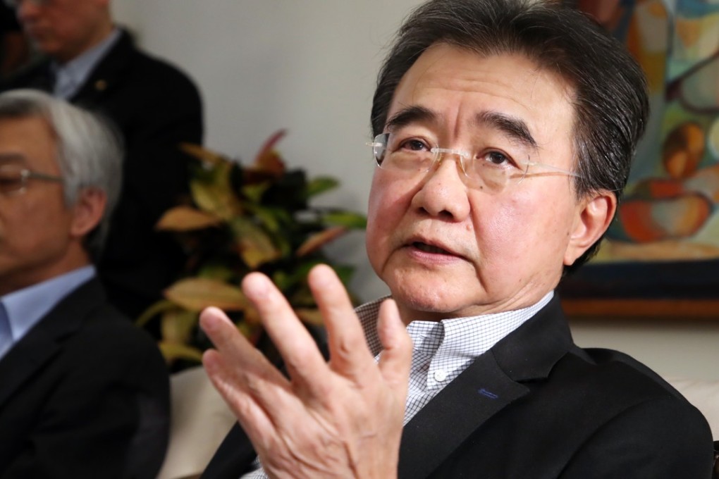 Baptist University president Roland Chin speaking to media on Wednesday about the controversy. Photo: Edward Wong