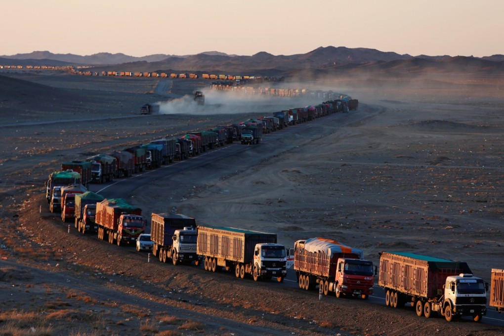 Thousands of heavy-duty trucks loaded with coal make their way along the sole road through the Gobi desert in Mongolia to the Chinese border. Photo: Reuters