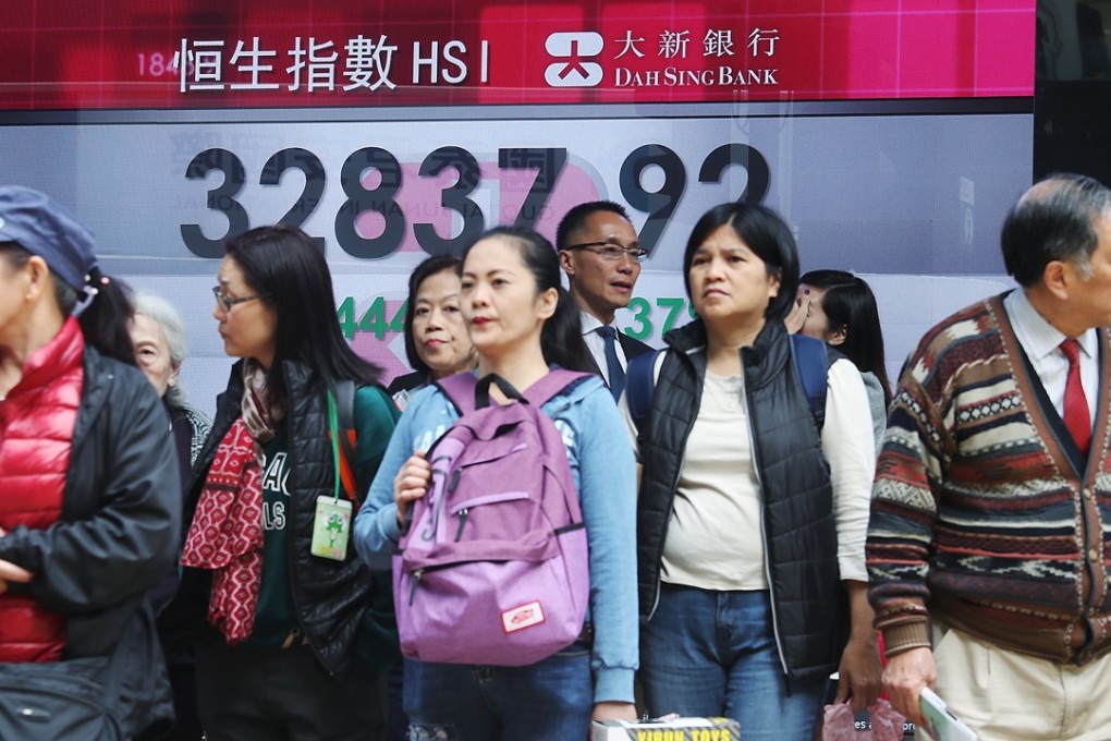 The rally in Hong Kong stocks paused on Thursday, as the benchmark Hang Seng Index ended lower for the first time in eight sessions. Photo: Edward Wong