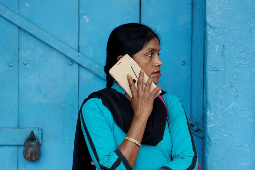 A woman talks on her mobile phone in Kolkata, India. Chinese smartphone makers now dominate the fast-growing market. Photo: Reuters