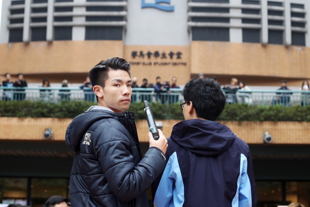 Student union leader Lau Tsz-Kei (left) and Andrew Chan speak during the protest. Photo: Winson Wong
