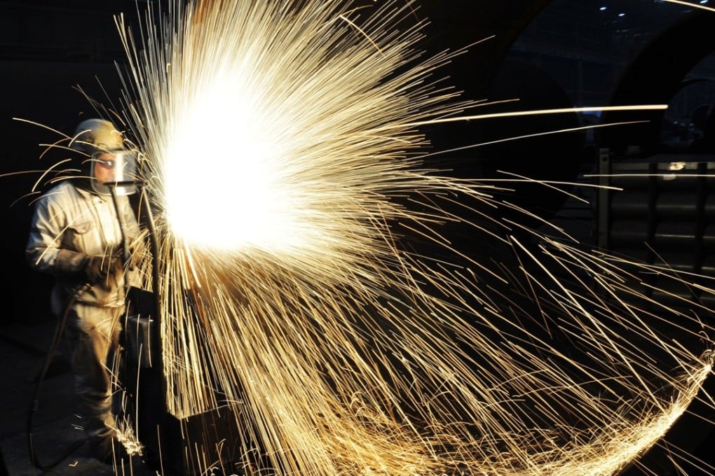 A staff member of Offshore Oil Engineering in Qingdao, east China's Shandong Province. China’s gross domestic product totalled 82.71 trillion yuan (about US$12.84 trillion) in 2017. Photo: Xinhua