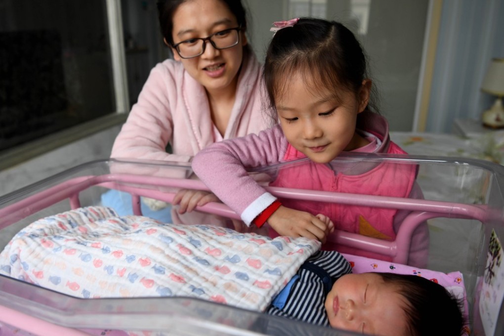 He Xin and her two children in a postnatal confinement centre in Hefei, Anhui province, last month. Photo: Xinhua