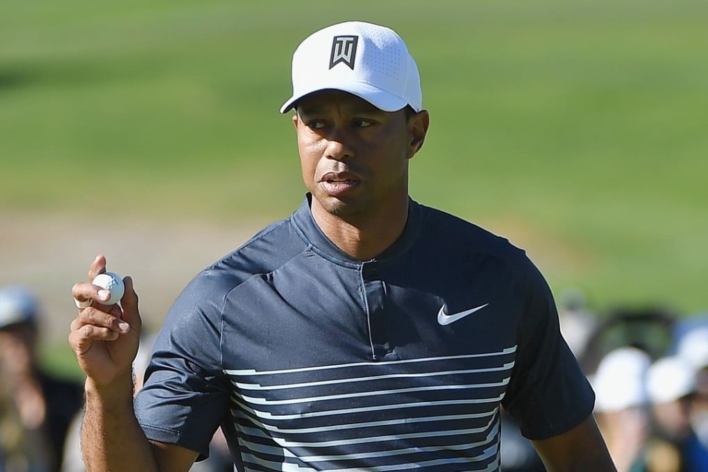 Tiger Woods celebrates after a putt on the seventh hole at the Farmers Insurance Open at Torrey Pines in San Diego, California. Photo: AFP
