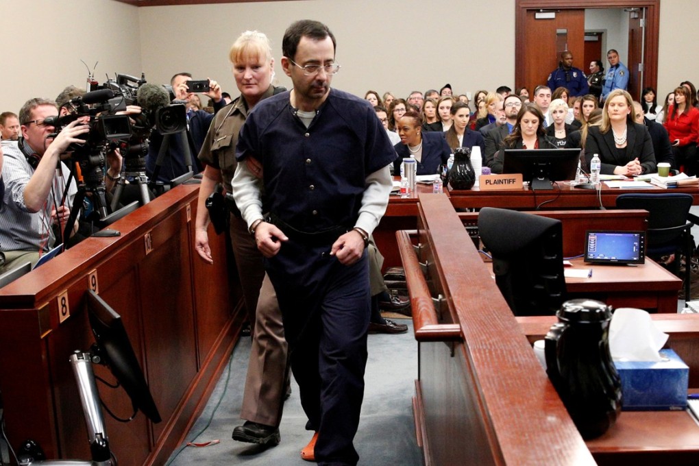 Larry Nassar, a former team USA Gymnastics doctor who pleaded guilty in November 2017 to sexual assault charges, is escorted into the courtroom during his sentencing hearing in Lansing, Michigan, on January 24, 2018. Photo: Reuters