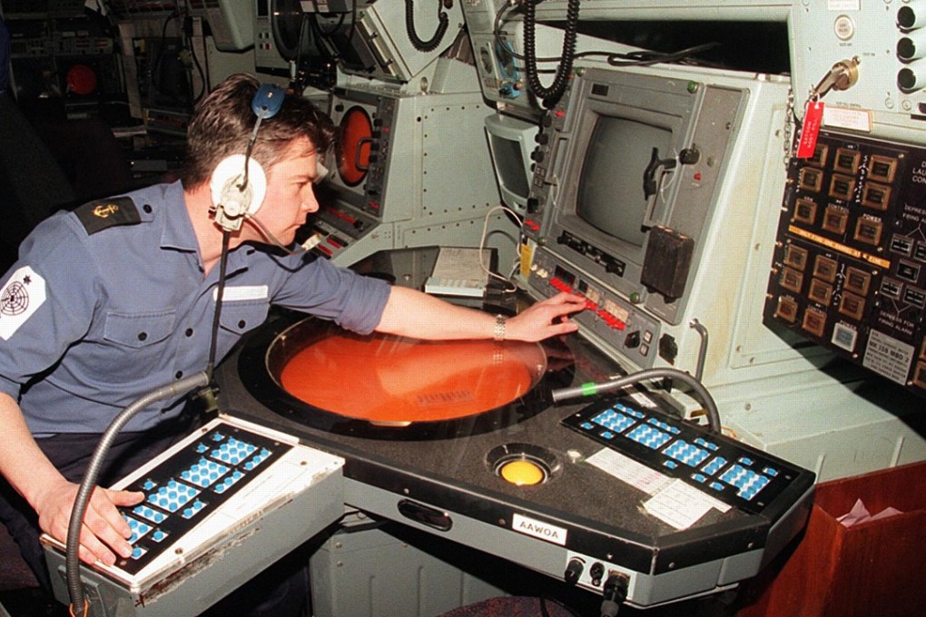 A British navy radar operator checking his equipment. Photo: AFP