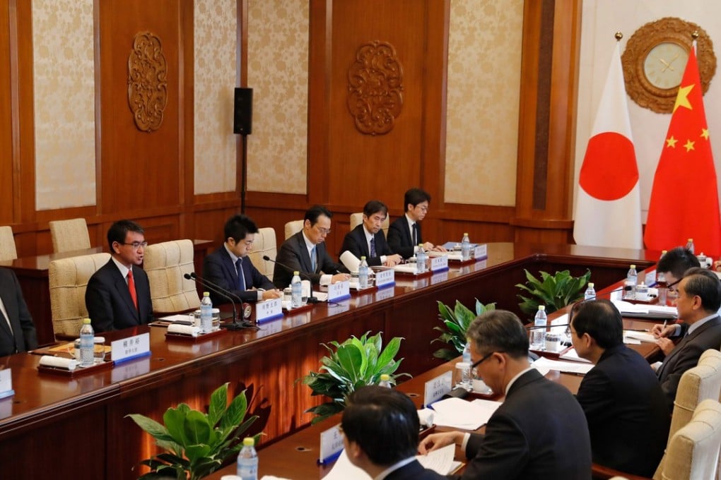 Japanese Foreign Minister Taro Kono holds talks with his Chinese counterpart Wang Yi in Beijing on Sunday. Photo: AFP